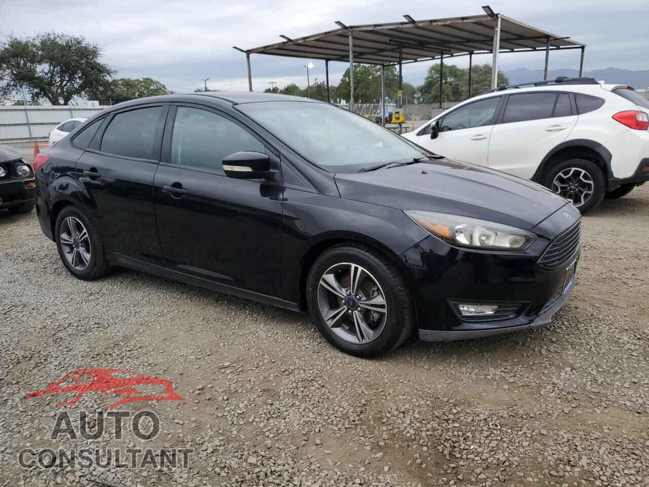FORD FOCUS 2016 - 1FADP3FE0GL225745
